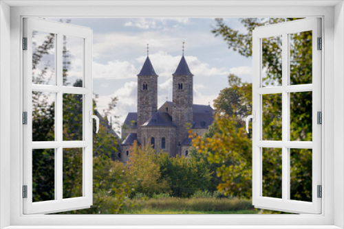 Autumn landscape with view of small village and Basiliek church along the Roer River valley, Sint Odiliënberg  is a small village in southeast of Holland, Located in Roerdalen, Limburg, Netherlands.