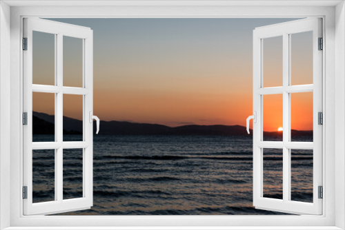 Fototapeta Naklejka Na Ścianę Okno 3D - Sunset at Agios Georgios beach in Chora of Naxos island, Cyclades, Greece