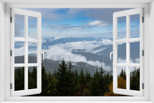 Fototapeta Naklejka Na Ścianę Okno 3D - Smoky Mountains Peak Through Autumn Clouds  Fog from Peak