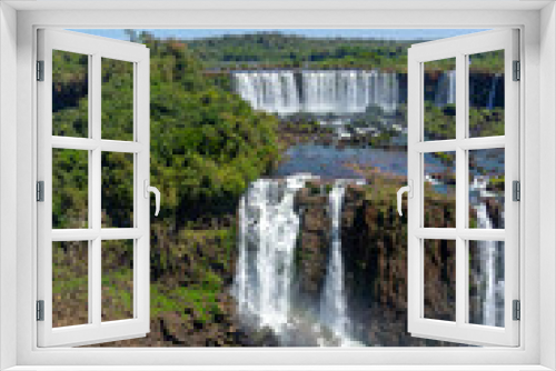 Fototapeta Naklejka Na Ścianę Okno 3D - Iguazu Falls, located on the border of Argentina and Brazil, is the largest waterfall in the world.