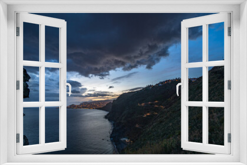 Fototapeta Naklejka Na Ścianę Okno 3D - Sunset at Ponta da Garajau with Cristo Rei statue on Madeira, Atlantic Ocean, Portugal