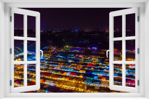 Fototapeta Naklejka Na Ścianę Okno 3D - BANGKOK, THAILAND, 14 JANUARY 2020: Aerial view of the colorful Ratchada Train Night Market aby night