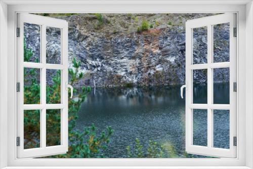 Fototapeta Naklejka Na Ścianę Okno 3D - Volcanic lake in a rocky landscape