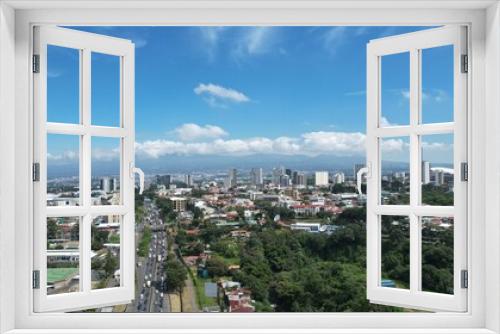 Fototapeta Naklejka Na Ścianę Okno 3D - Aerial view of La Sabana park and San Jose, Costa Rica from the West	