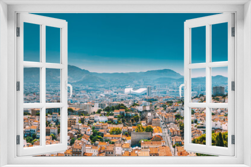 Urban panorama, aerial view, cityscape of Marseille, France. Sunny summer day with bright blue sky. Cityscape of Marseille, France. Urban background with sport Velodrome stadium. Stade Velodrome