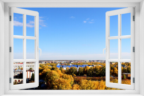 Fototapeta Naklejka Na Ścianę Okno 3D - Autumn city on a sunny clear day. Yellow leaves on the trees. View from above.