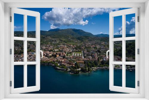 Fototapeta Naklejka Na Ścianę Okno 3D - Aerial view of the city of Garda, Lake Garda, Italy. Panorama on corno. Vista lago on the coastline. Top view of the Museum of Lake Garda on the coastline.
