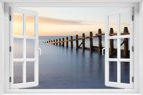 Fototapeta Naklejka Na Ścianę Okno 3D - Long Exposure Beach Sunrise with Groyne