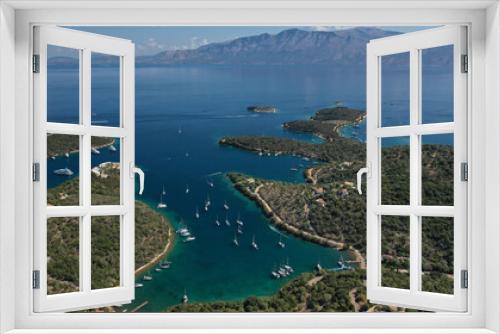 Fototapeta Naklejka Na Ścianę Okno 3D - Aerial drone photo of safe anchorage of fjord bays in Meganisi island with crystal clear calm sea, Meganisi island, Ionian, Greece