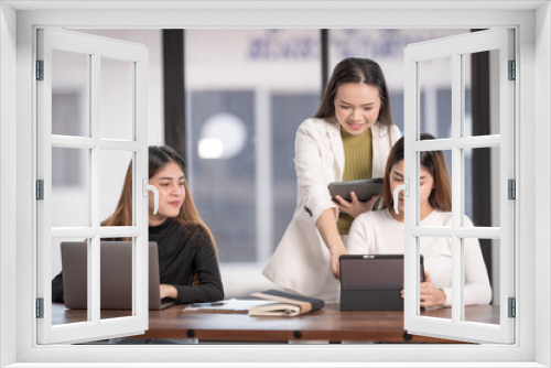 College instructors and advisors meet female college students to advise their research study. Education Concept Stock Photo