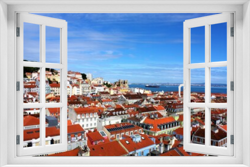 Fototapeta Naklejka Na Ścianę Okno 3D - Lisbon, Portugal - June, 2019: Panoramic view of the Lisbon rooftops and the Douro River from the observation deck of Santa Justa elevator.