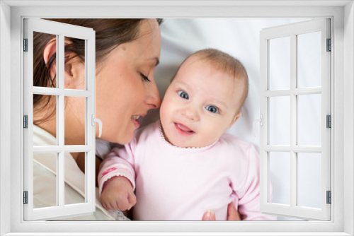 joyful mother with her daughter baby