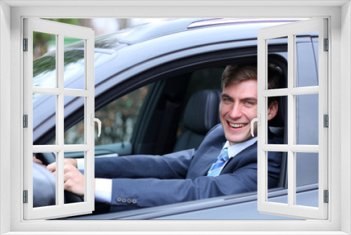 young attractive man young man in the car