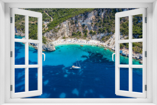 Fototapeta Naklejka Na Ścianę Okno 3D - Aerial drone photo of iconic paradise sandy beach of Agiofili near port of Vasiliki with emerald crystal clear sea and sail boats docked, Lefkada island, Ionian, Greece