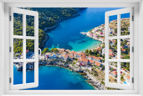 Fototapeta Naklejka Na Ścianę Okno 3D - Assos picturesque fishing village from above, Kefalonia, Greece. Aerial drone view. Sailing boats moored in turquoise bay