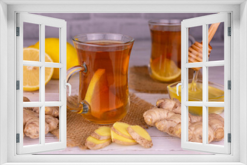 Fototapeta Naklejka Na Ścianę Okno 3D - Tea with ginger and lemon in transparent cups.