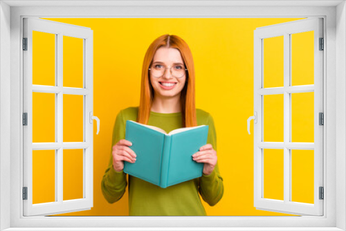 Photo portrait red haired woman in glasses reading book isolated vivid yellow color background