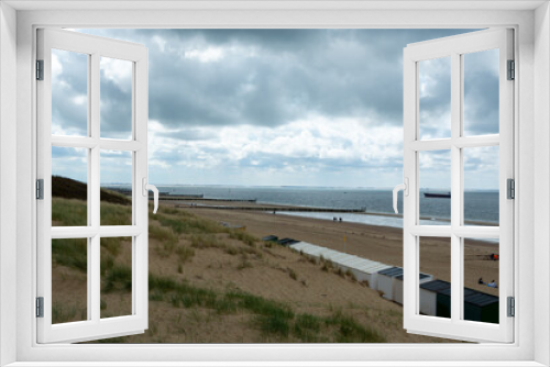 Fototapeta Naklejka Na Ścianę Okno 3D - View on white sandy  beach, dunes and water of North sea between Vlissingen en Domburg, Zeeland, Netherlands