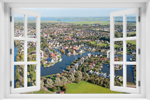 Fototapeta Naklejka Na Ścianę Okno 3D - Aerial from the traditional village Koudum in Friesland Netherlands