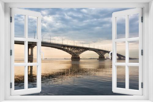 Fototapeta Naklejka Na Ścianę Okno 3D - Bridge over the river Volga in sunset. The bridge connects Saratov and Engels. Russia