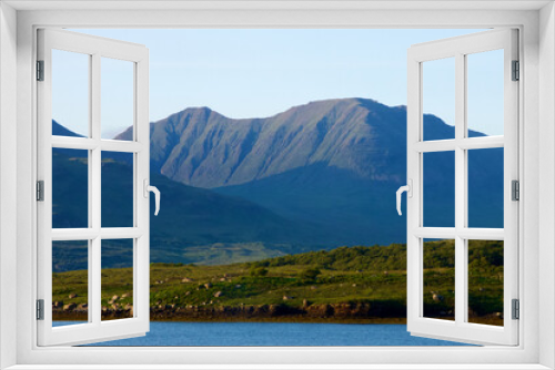 Fototapeta Naklejka Na Ścianę Okno 3D - Dramatic view of a Scottish loch in the Highlands with mountains 