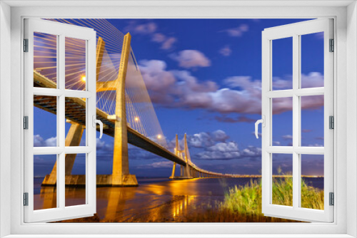 Fototapeta Naklejka Na Ścianę Okno 3D - Lisbon Portugal bridge Ponte Vasco da Gama over Tejo river town travel