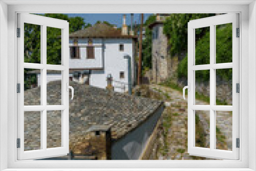 Fototapeta Naklejka Na Ścianę Okno 3D - The picturesque village of Makrinitsa with its architectural traditional old stone  buildings located on Pelion mountain , above Volos town ,Magnisia,Greece.