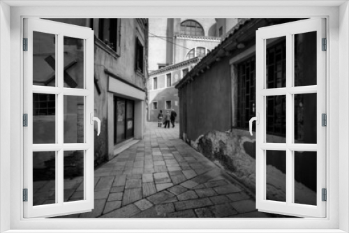 Fototapeta Naklejka Na Ścianę Okno 3D - Black and white. Early morning walks through the streets of the old city of Venice. Venice without water. Squares and streets of the old town. Italy. Veneto.