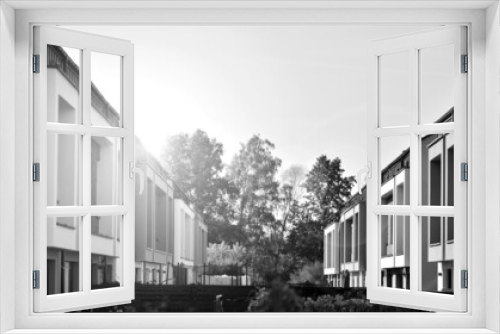 Fototapeta Naklejka Na Ścianę Okno 3D - Modern single family terraced homes. Newly built homes in a residential estate. Black and white.
