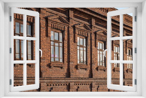 Fototapeta Naklejka Na Ścianę Okno 3D - Brick wall of an old 19th century building with large windows. Wall of an old red brick building with six windows