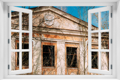 Fototapeta Naklejka Na Ścianę Okno 3D - Abandoned Ruined Old Village School Building In Chernobyl Resettlement Zone. Belarus. Chornobyl Catastrophe Disasters. Dilapidated House In Belarusian Village. Whole Villages Must Be Disposed