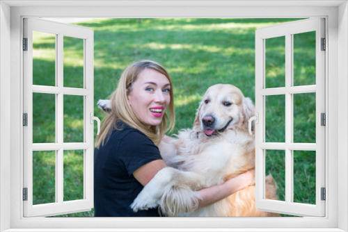 Fototapeta Naklejka Na Ścianę Okno 3D - woman with her retriever dog in summer park