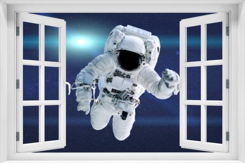 Fototapeta Naklejka Na Ścianę Okno 3D - Space astronaut in outer space with lens flare. Science fiction wallpeper. Elements of this illustration were furnished by NASA.