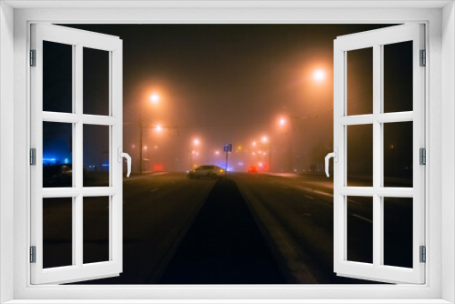 Fototapeta Naklejka Na Ścianę Okno 3D - Empty street at foggy night in a city