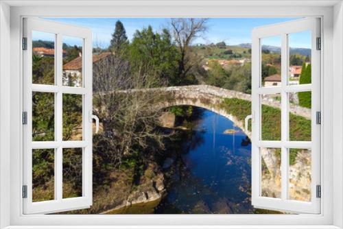 Fototapeta Naklejka Na Ścianę Okno 3D - Aerial view of a scenic medieval bridge in Lierganes, Cantabria, Spain. High quality photo
