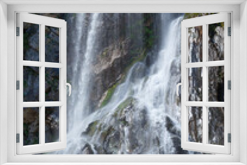 Fototapeta Naklejka Na Ścianę Okno 3D - Waterfall on gray green stone rock texture background