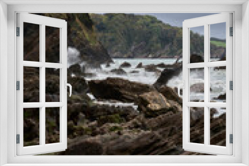 Fototapeta Naklejka Na Ścianę Okno 3D - Rocky beach scene from a remote location in Devon UK