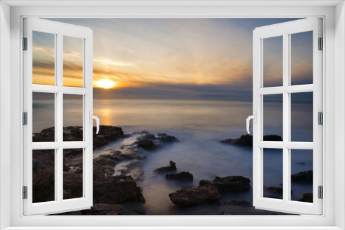 Fototapeta Naklejka Na Ścianę Okno 3D - Sunrise with the rough sea on the Costa Azahar