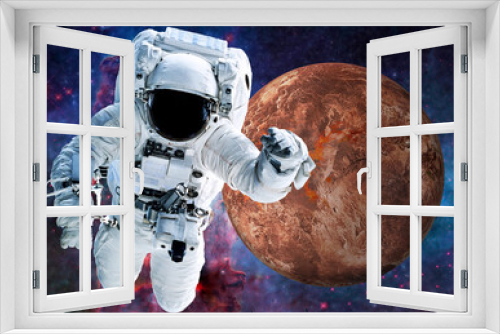 Fototapeta Naklejka Na Ścianę Okno 3D - Astronaut near Fiction red planet Mars somewhere in space. Selective focus. Science fiction. Elements of this image were furnished by NASA