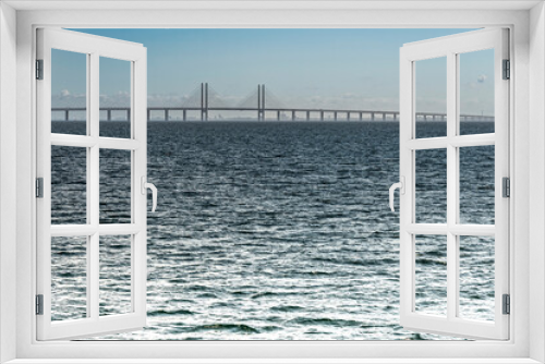Fototapeta Naklejka Na Ścianę Okno 3D - Oresund - the Öresund bridge in the sea between Copenhagen and Malmo on a sunny day from the seaside