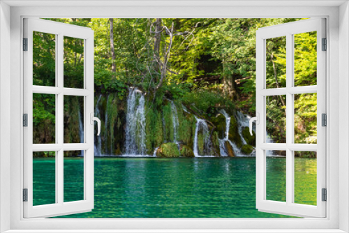 Fototapeta Naklejka Na Ścianę Okno 3D - Waterfalls flowing into the crystal water of Lake Plitvice