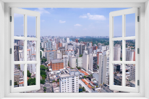 Fototapeta Naklejka Na Ścianę Okno 3D - Aerial view of Jardins district in São Paulo, Brazil. Big residential and commercial buildings in a prime area near Av. Paulista with Ibirapuera Park on background. 