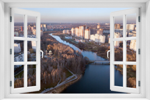 Fototapeta Naklejka Na Ścianę Okno 3D - Aerial view of the residential neighborhood and public park on the banks of Pekhorka river. City of Balashikha, Moscow oblast, Russia.