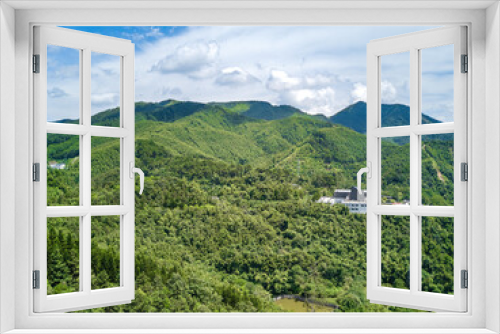 Fototapeta Naklejka Na Ścianę Okno 3D - Kunlun Pass Memorial Hall in Nanning, Guangxi, China and the scenery of blue sky and green mountains