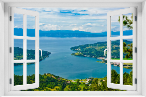 Fototapeta Naklejka Na Ścianę Okno 3D - The beauty of Lake Toba which is a caldera lake comes from an ancient volcanic eruption and is the largest volcanic lake in the world. View from geosite hutaginjang. North Sumatra, Indonesia