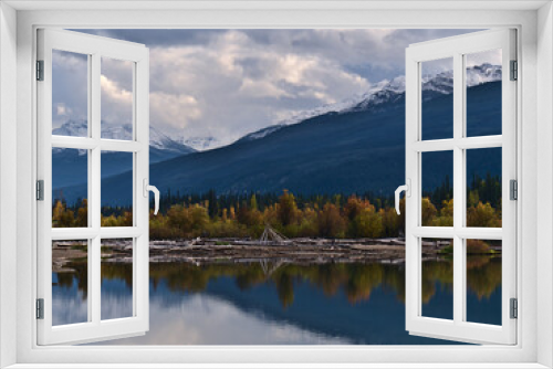 Fototapeta Naklejka Na Ścianę Okno 3D - View of the southern shore of Moose Lake in Mount Robson Provincial Park, British Columbia, Canada with colorful trees reflected in the water.