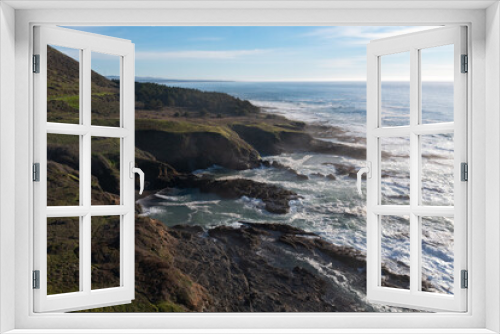 Fototapeta Naklejka Na Ścianę Okno 3D - The cold Pacific Ocean washes onto the rugged coastline of Northern California north of Fort Bragg. The Pacific Coast Highway runs right along this scenic region in Mendocino County.