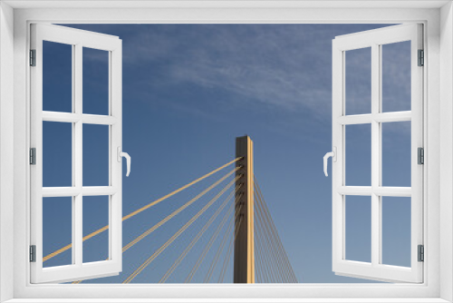 Fototapeta Naklejka Na Ścianę Okno 3D - 多摩川に掛かる橋の支柱。夕陽に照らされる府中四谷橋。