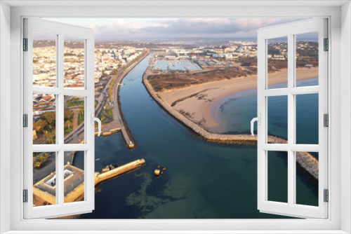 Fototapeta Naklejka Na Ścianę Okno 3D - Aerial from the city Lagos in the Algarve Portugal at sunrise marina harbor