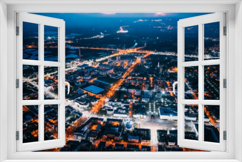 Fototapeta Naklejka Na Ścianę Okno 3D - Brest, Belarus. Top View Of Cityscape Skyline City In Night Illuminations. Aerial View Of Lenin Square, Lenin Street, Stadium In Evening Illumination